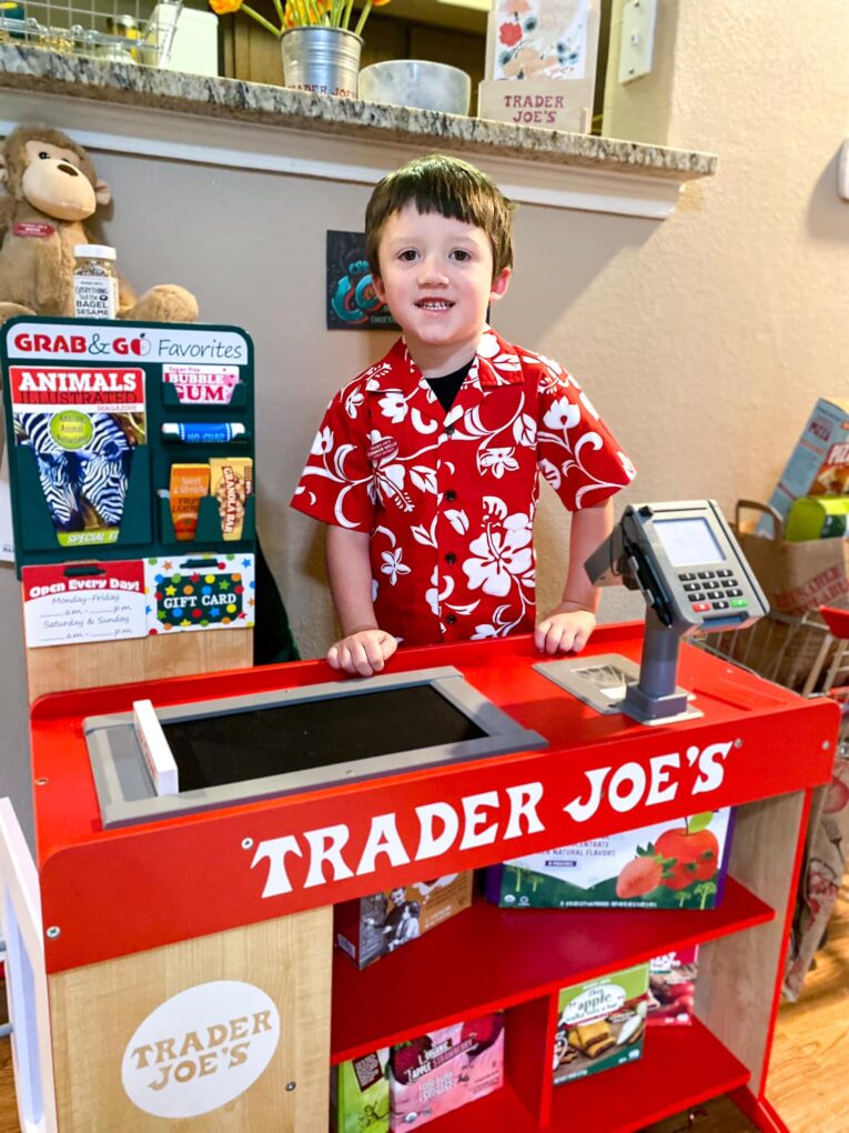 Kids playing with a Trader Joe's themed grocery play store
